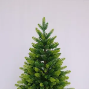 Lush green artificial PE and PVC Christmas tree with dense needles and brown trunk details