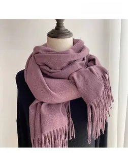 Detailed texture of thick quicksand purple tassel scarf on a mannequin
