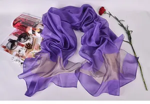Detail of dark purple 100% silk scarf with golden gradient and fashion accessories