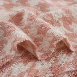 Soft pink and white houndstooth scarf made of thick cashmere-like warm fabric