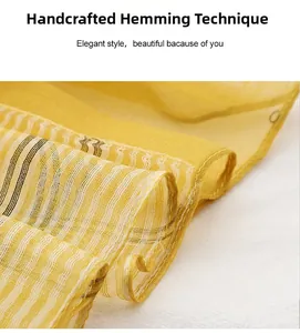 Detail of hand-stitched edging on yellow striped silk wool scarf with sheer texture