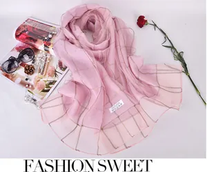 Pink silk scarf with gold grid pattern, 100% silk label detail and stylish accessories