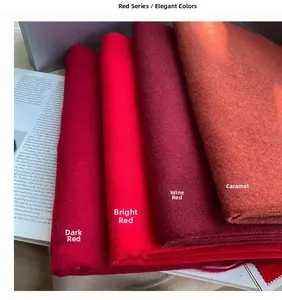 Detailed texture view of thick cashmere scarves in various classic red and wine tones