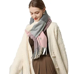 Women's plaid cashmere blend scarf with pink and purple patchwork design and tassels