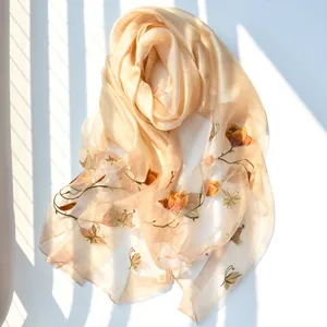 Elegant champagne silk scarf with floral butterfly embroidery and soft light shadow effect