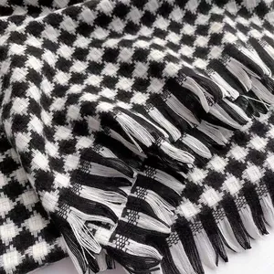 Elegant black and white houndstooth cashmere scarf with thick decorative fringe details