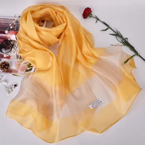 Elegant 100% silk yellow striped shawl scarf with luxury accessories on white backdrop