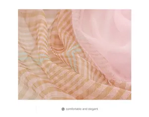 Detail of silk wool plaid scarf showing light pink and brown striped sheer fabric texture