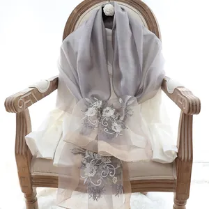 Elegant grey silk wool shawl for women featuring intricate floral embroidery details