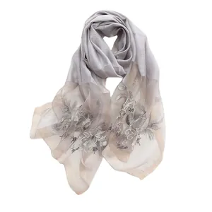 Elegant grey silk wool shawl featuring detailed floral embroidery and patchwork design