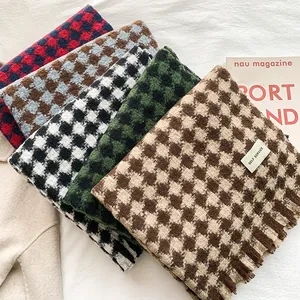 Classic houndstooth winter scarves in five colors with soft fringe tassels on white fabric