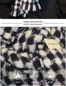 Detail of houndstooth scarf texture with fringe and self-service label on black coat