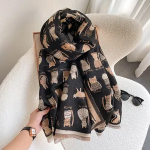 Detail of black cat print scarf with soft tassels and premium cashmere-like texture