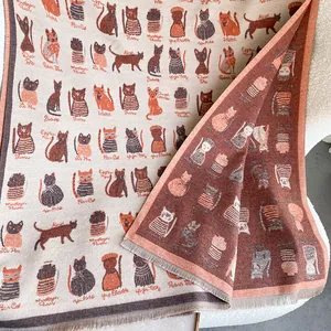 Detail of cartoon cat jacquard scarf with decorative fringes and double-sided knitting