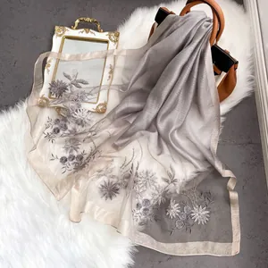 Elegant embroidered silk wool scarf with pearl accents and floral patterns for women