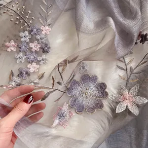 Elegant silk wool scarf with intricate floral embroidery and golden thread accents