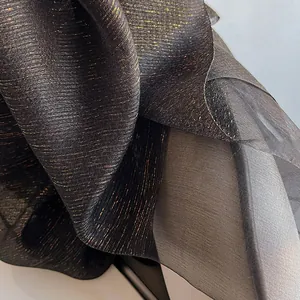 Elegant silk wool scarf with gold metallic thread and pleated luxury fabric texture