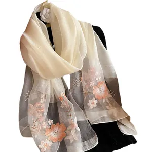 Elegant silk wool embroidered shawl with floral patterns on gradient translucent fabric