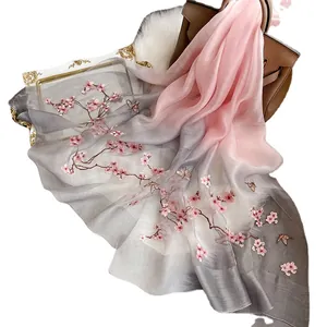 Elegant silk wool scarf with pink cherry blossom embroidery and gradient color design