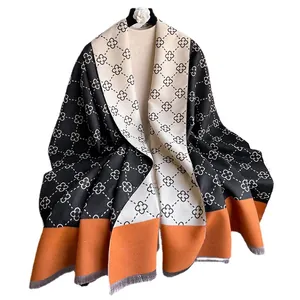Thick cashmere-like scarf with clover pattern, fringe edges and autumn color block design