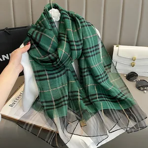 Detail of forest green plaid silk scarf with gold lurex threads and lace trim mesh