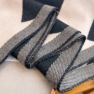 Detail of soft wave pattern knit scarf with premium stitching and thick cashmere texture