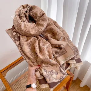 Detailed view of French vintage floral pattern on thick cashmere-like scarf with fringe