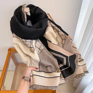 Detail shot of the elegant horse print scarf with refined tassels and thick texture