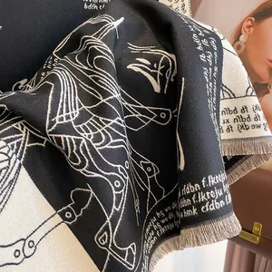 Detail of black and white Pegasus pattern scarf with tassels and cashmere texture