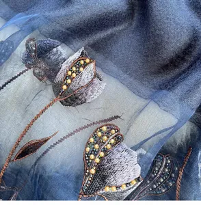 Detail of navy blue silk blend scarf with tulip floral embroidery and beaded texture