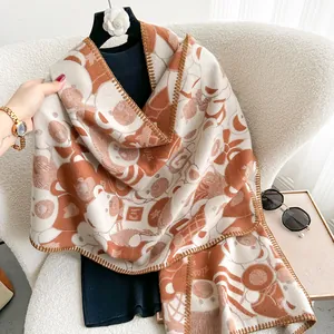 Detail of bear patterned scarf with thick edges and soft cashmere-like texture