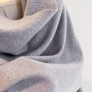 Close-up of light purple thick loop textured scarf showing soft fiber knit details
