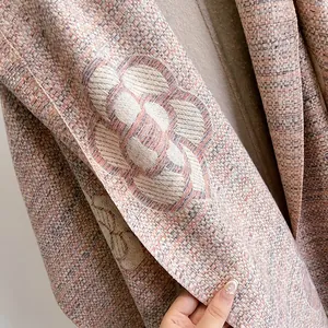 Pink camellia woven scarf with thick knit texture and floral pattern for women