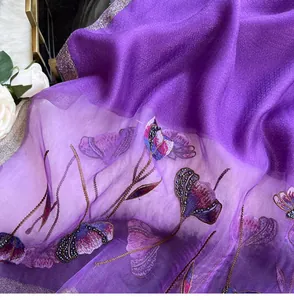 Detail of purple silk scarf with 3D flower embroidery and beaded butterfly sequins