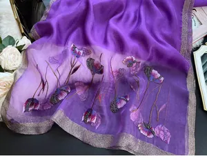 Detail of elegant purple silk blend shawl with floral embroidery and bead accents