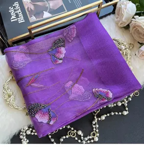 Close-up of purple silk blend scarf with delicate floral embroidery and beadwork details