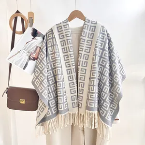 Elegant geometric jacquard knitted shawl with tassels and warm wool-like texture