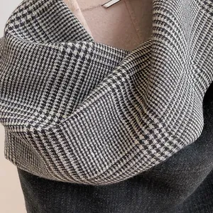 Close-up of classic black and white plaid scarf with premium thick cashmere texture