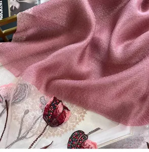 Detail of pink silk blend shawl featuring tulip embroidery and handcrafted beadwork