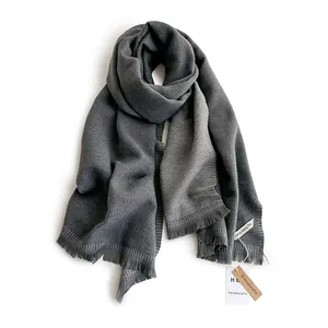 Dark grey cashmere-like scarf with soft fringe tassels and minimalist solid color design