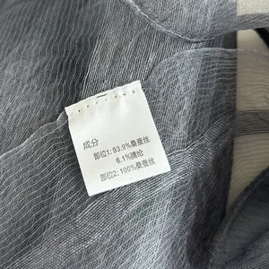 Detailed view of the fabric care label showing 100% mulberry silk material composition