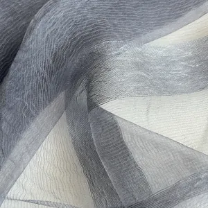 Detailed macro view of grey gradient organza silk scarf with subtle pleated texture