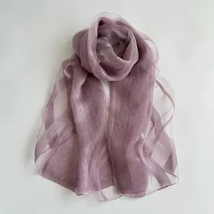 Detailed close-up of light purple silk scarf showing soft texture and translucent fabric