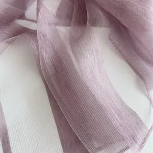 Detail shot of sheer striped lavender fabric showing fine texture and light shimmer