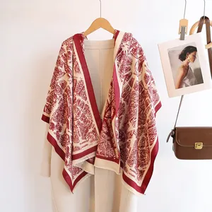 Detail of red and white vintage architecture print on soft cashmere-like shawl with tassels