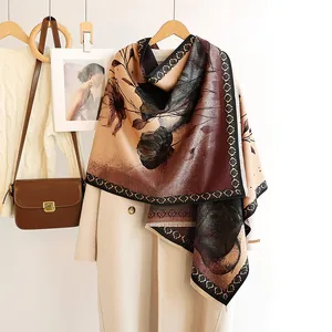 Detail of cashmere-feel shawl featuring vintage floral patterns and hand made label
