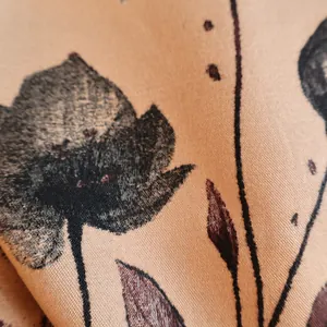 Close-up of vintage floral print fabric with twill texture for a warm winter scarf