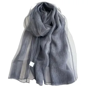 Translucent gray silk scarf for women featuring a lightweight mesh texture and rolled edges