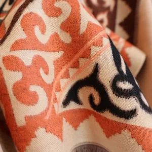 Macro detail of bohemian horse jacquard scarf showing soft cashmere-like knit texture