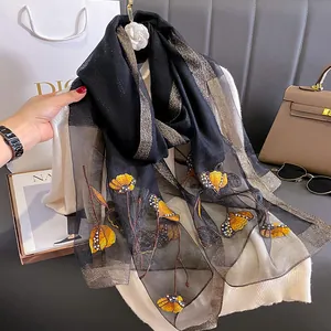 Elegant silk blend long scarf in black and gold with floral embroidery and pearl beads